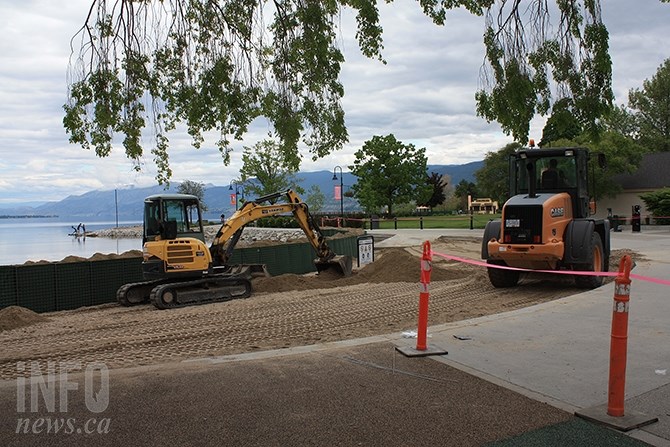Construction of gabion walls along Okanagan Lake will limit access and use of the beach by the public while flood potential exists, say city officials.