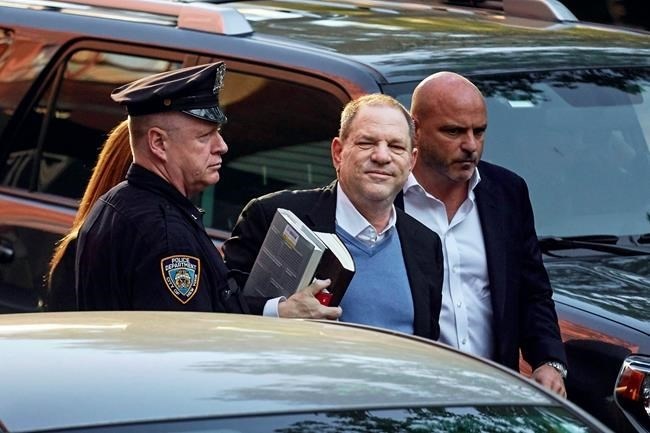 Harvey Weinstein arrives at the first precinct while turning himself to authorities following allegations of sexual misconduct, Friday, May 25, 2018, in New York.