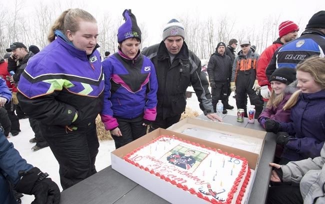The family of one of 16 people killed in a crash involving the Humboldt Broncos bus has filed a lawsuit. Humboldt Broncos' Adam Herold's father Russell, mother Raelene and sister Erin prepare to blow out the 17 candles on his cake as family and friends celebrate what would have been Adam's 17th birthday in Montmartre, Sask., on Thursday, April 12, 2018.