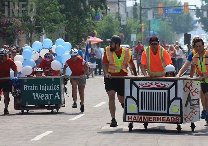 Winner Greyback Hammerheads' peach bin duke it out with the Brain Injury Society's entry in this afternoon's Peach Bin Race in Penticton, Aug. 8, 2018.
