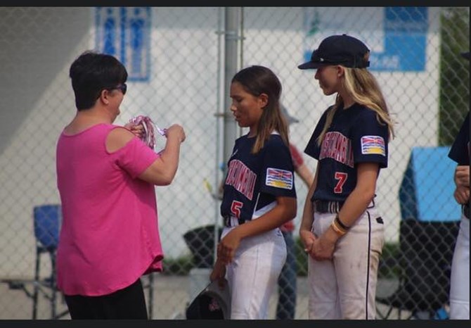 Kadence Martin is given her gold medal after playing with Team B.C. at the Western Canada Baseball Championships.