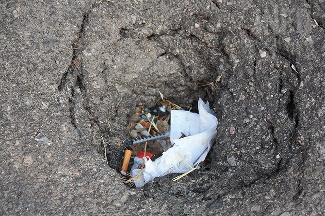 Bylaw officers need a trained eye to spot discarded needles in a Penticton alleyway.