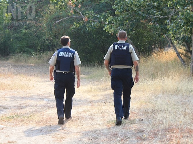 FILE PHOTO - Penticton bylaw officers Darren Calibaba and Glenn Duffield patrolling a portion of the Penticton River path near Creekside Road.