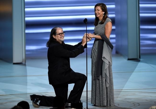 Glenn Weiss , left, proposes to Jan Svendsen at the 70th Primetime Emmy Awards on Monday, Sept. 17, 2018, at the Microsoft Theater in Los Angeles.
