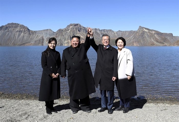 South Korean president Moon Jae-in, second from right, and his wife Kim Jung-sook, right, stand with North Korean leader Kim Jong Un, second from left, and his wife Ri Sol Ju on the Mount Paektu in North Korea, Thursday, Sept. 20, 2018.
