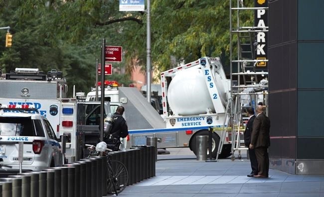 An NYPD bomb squad vehicle departs an area outside Time Warner Center on Wednesday, Oct. 24, 2018, in New York. Law enforcement officials say a suspicious package that prompted an evacuation of CNN's offices is believed to contain a pipe bomb.