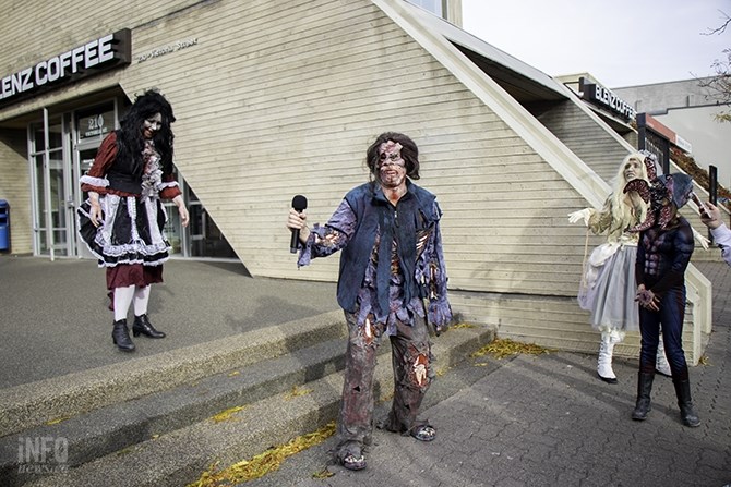 It's time for zombies to come up and give the audience their best groan. Una Connor (centre) takes a turn. Connor is a Kamloops artist and has been doing the zombie walk for about five years. She spent about four hours putting her costume together for today's walk.