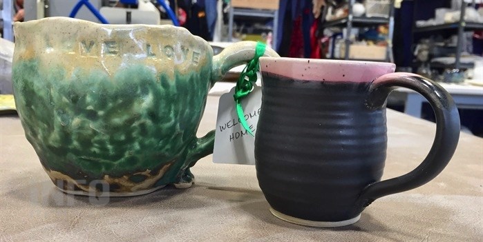 These are two of 50 hand-made mugs from That Pottery Place, donated to the tenants moving into Hearthstone supportive housing next week.