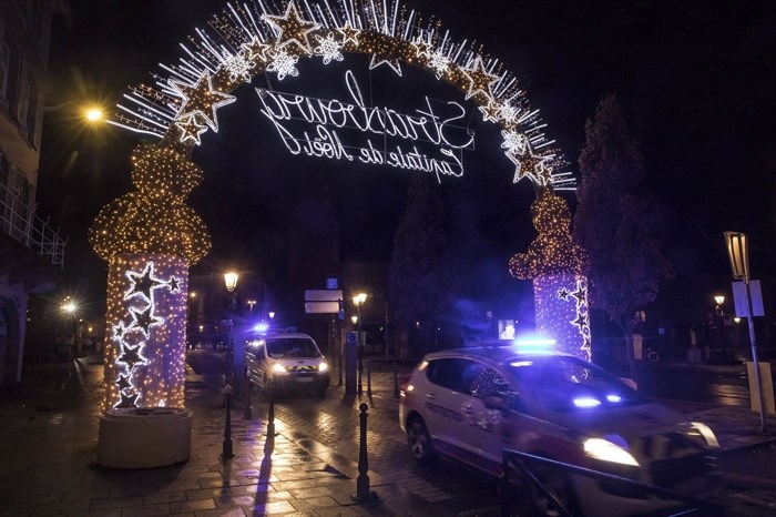 Police vehicles move at the center of the city of Strasbourg following a shooting, eastern France, Tuesday Dec. 11, 2018.