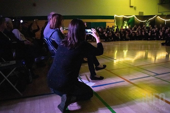 Rhianna Jacometti takes photos of the performance. She has two kids in the show in Kindergarten and Grade Four. 