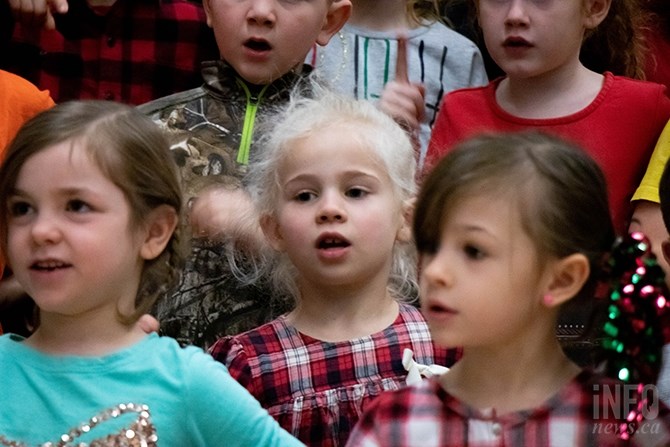 Anna MacFarlane, age six, is singing in the Kamloops School of Art Christmas show for the first time. Her teacher, Carmelina Woods, says, 