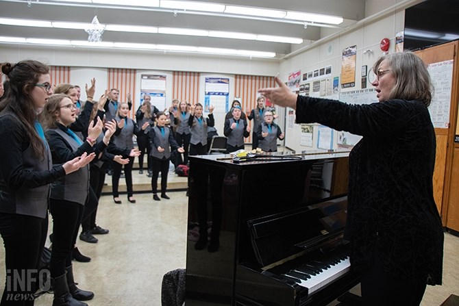 The KSA Secondary Choir warm up before the afternoon performance on Dec. 20, 2018. Ellen McMillan leads the vocal warm up. 