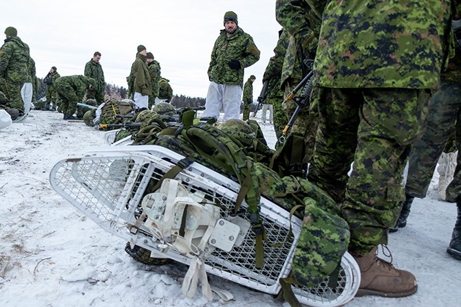 Rucksacks containing, bedding, rations, weapons, clothing and anything else the soldiers will need are lined up in the snow. The sacks can weigh anywhere from approximately 65 pounds (29.5 kilograms) to 95 pounds (43 kilograms) depending on what equipment they take with them.