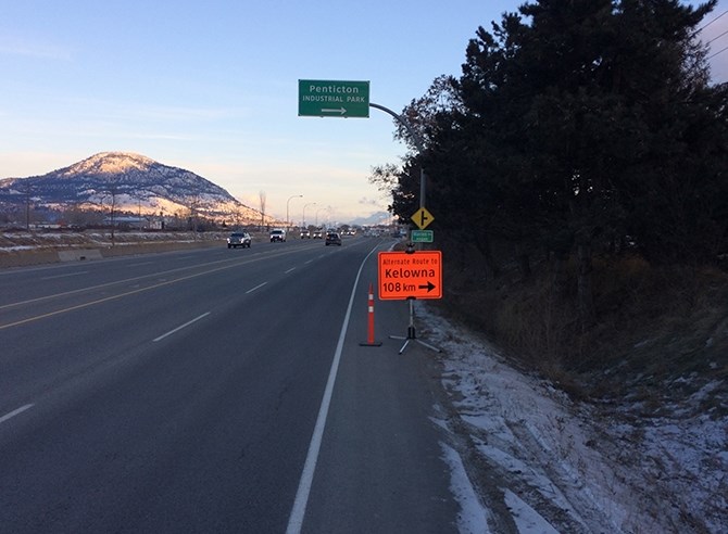 A sign on Penticton's Channel Parkway indicates the alternate route to Kelowna and points north via the 201 Forest Service Road.
