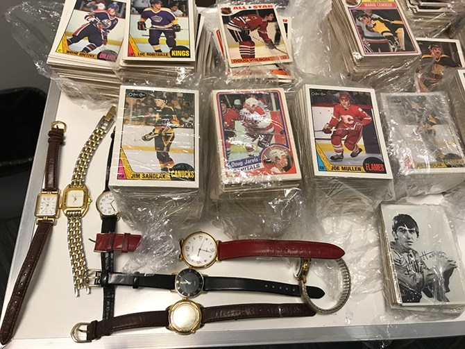 Penticton RCMP hope to reunite this found hockey card and coin collection with its rightful owner.