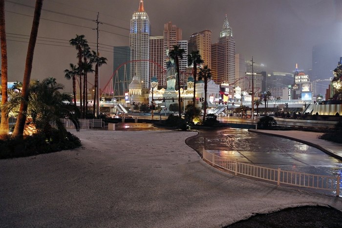 A dusting of snow covers an area along the Las Vegas Strip, Thursday, Feb. 21, 2019, in Las Vegas. A winter storm is expected to drop up to 3 inches (8 centimetres) of snow on Las Vegas' southern and western outskirts while other parts of the metro area will get rain mixed with snow.