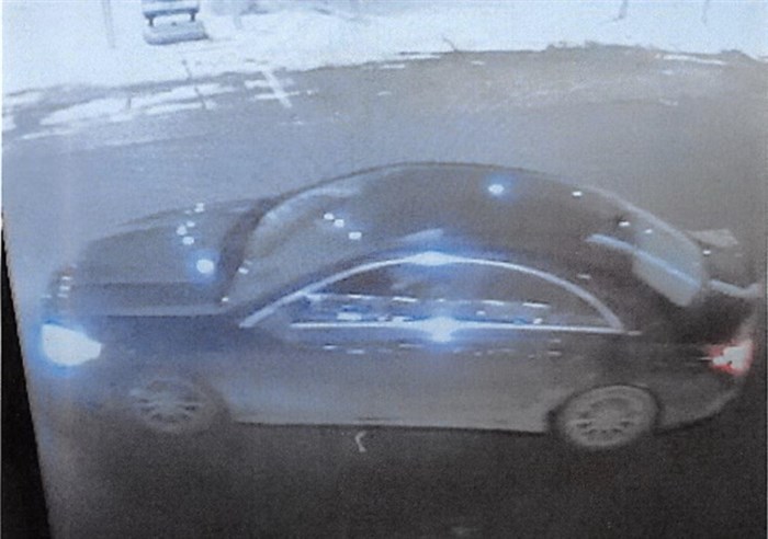 A screen shot of video surveillance shows that the vehicle appears to be a dark-coloured four-door-sedan, with aluminum rims and chrome trim around the driver and passenger door windows. Police say the vehicle may be either a Chrysler, Mercedes or BMW.