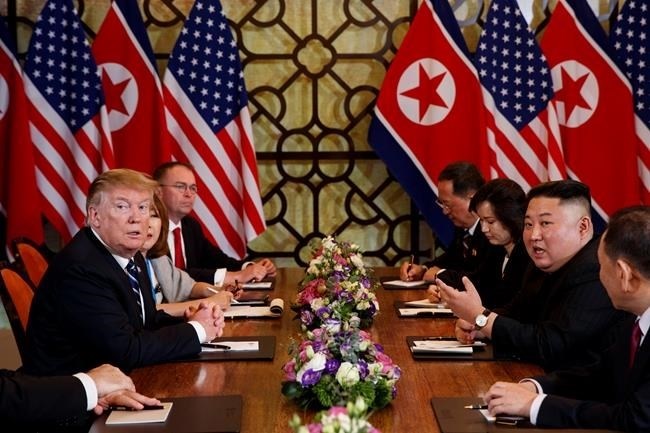President Donald Trump listens as North Korean leader Kim Jong Un answers a question from reporters during a meeting, Thursday, Feb. 28, 2019, in Hanoi.