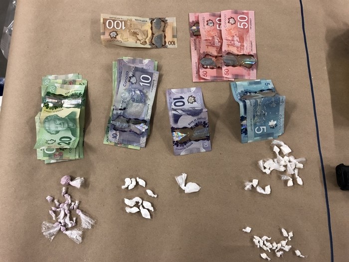 Uniformed Gang Enforcement team members seized cash and drugs.