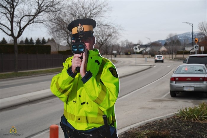 Const. Warren Ning with the Kelowna RCMP's municipal traffic section is pictured monitoring drivers in a city school zone.