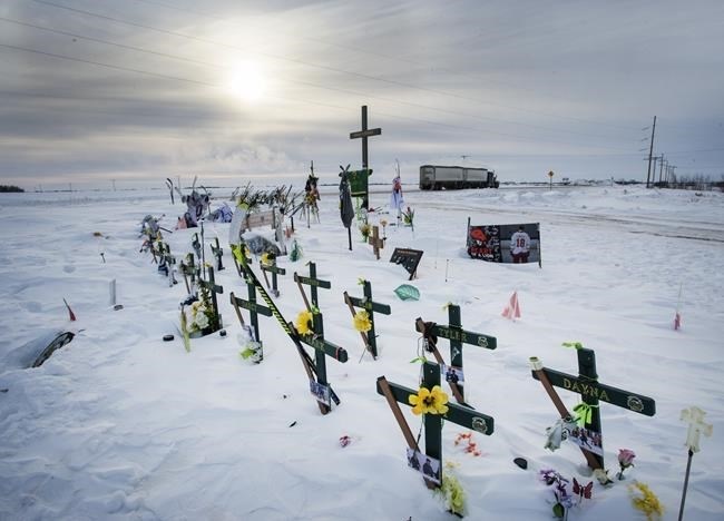 A memorial for the 2018 crash where 16 people died and 13 injured when a truck collided with the Humboldt Broncos hockey team bus, is shown at the crash site on Wednesday, January 30, 2019 in Tisdale, Saskatchewan. The driver of a transport truck involved in a deadly crash with the Humboldt Broncos hockey team bus will be sentenced Friday.