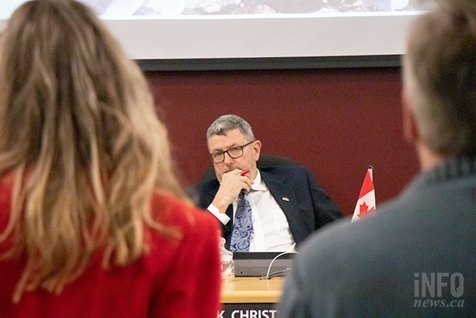 Kamloops Mayor Ken Christian listens as Michele Hadley with the group Ban the Bag Kamloops (left) presents information on the harm single-use plastics cause to the environment on Tuesday, March 26, 2019.