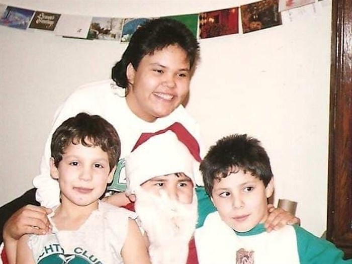 Jason (left) is pictured with his Aunt Cheryl and brother Michael.
