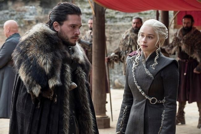 This image released by HBO shows Kit Harington, left, and Emilia Clarke on the season finale of 