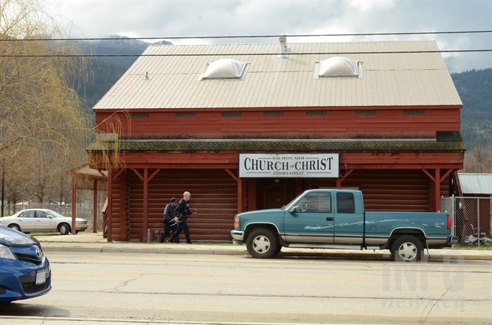 RCMP officers out the Salmon Arm Church of Christ, Apr. 15.