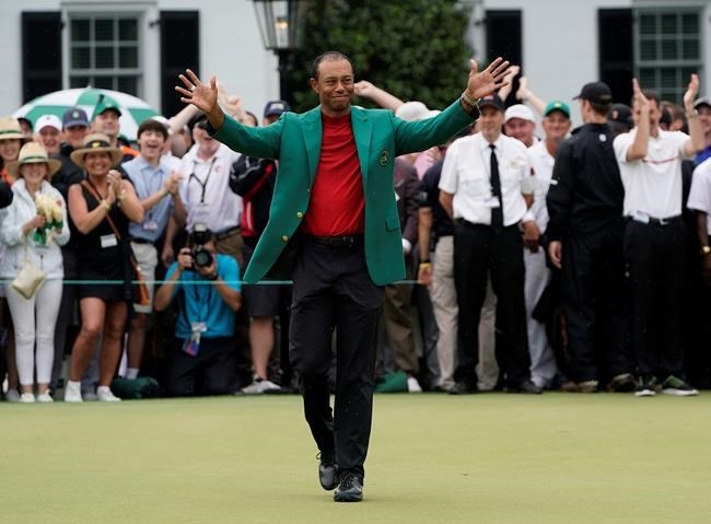 Tiger Woods celebrates after he won the Masters golf tournament Sunday, April 14, 2019, in Augusta, Ga.