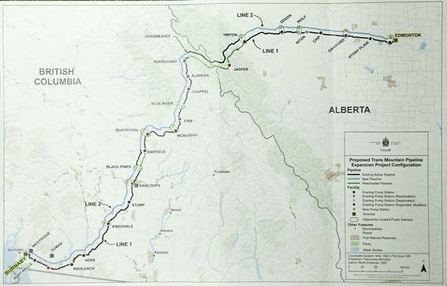 A map of the proposed Trans Mountain pipeline expansion is shown as the National Energy Board releases the board's reconsideration report on marine shipping related to the expansion project, in Calgary, Alta., Friday, Feb. 22, 2019. The federal government is extending the deadline to make a decision on Trans Mountain pipeline expansion project to June 18. 