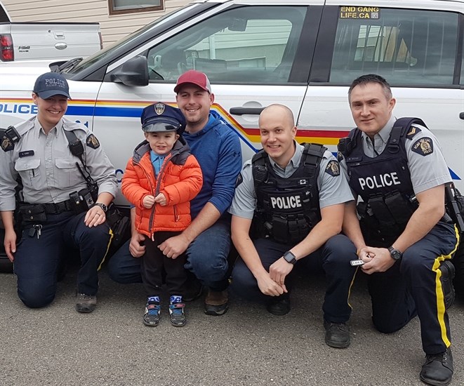 Reid and his father Mike pose with Kamloops RCMP Const. Sine (left), Const. Tucker and Cpl. Blair Wood at his fourth birthday party on Saturday, April 27, 2019.