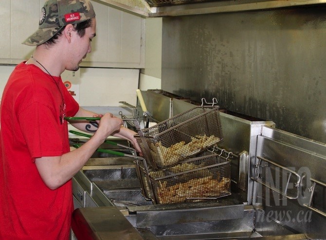 Keanan Mak cooks the hand cut fries at Shady Rest Fish and Chips