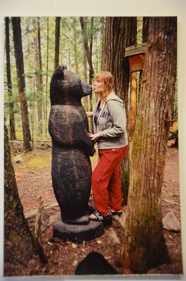 Hannah Briggs with the bear carved by Fern Makarenko 2003.