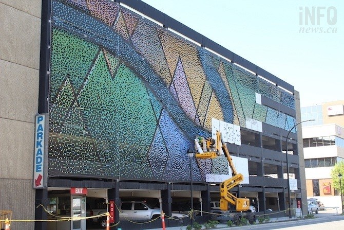 FILE PHOTO - Workers are seen installing the pieces of the mosaic on the downtown Kamloops parkade on Monday May 27, 2019.
