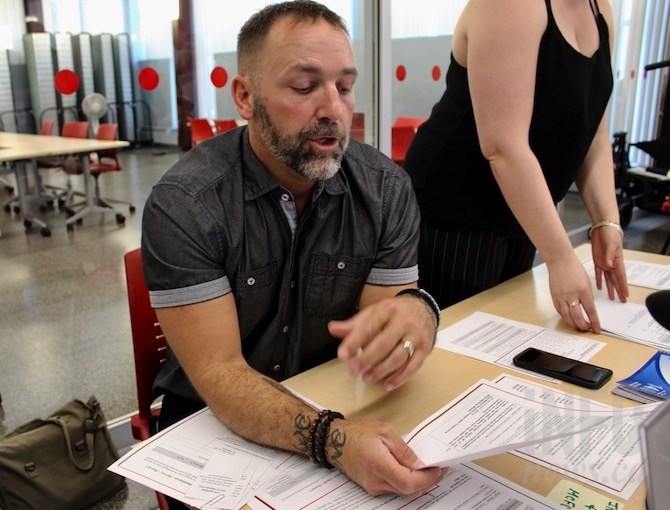 This man, who goes by the name G, played the role of a worker at the Ministry of Children and Families at the Homelessness Simulator in Kelowna, Tuesday, May 28, 2019.