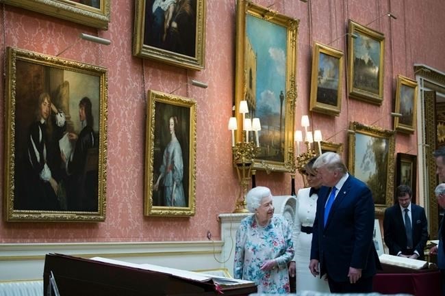 Queen Elizabeth II shows items in the Royal Gifts collection to first lady Melania Trump and President Donald Trump at Buckingham Palace, Monday, June 3, 2019, in London. 