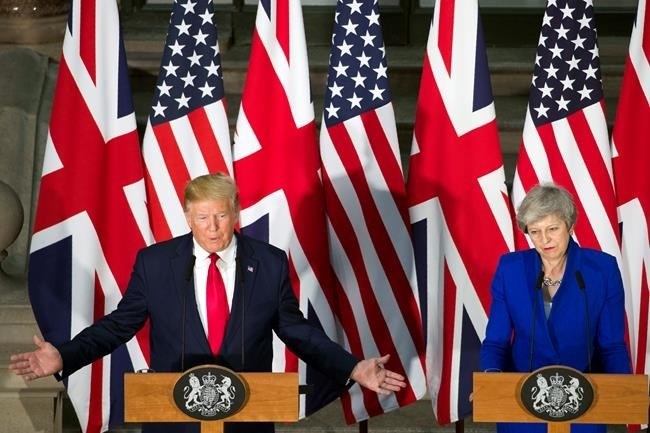 President Donald Trump speaks during a news conference with British Prime Minister Theresa May at the Foreign Office, Tuesday, June 4, 2019, in central London.