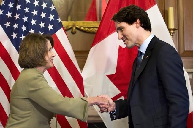 Canadian Prime Minister Justin Trudeau shakes hands with House Minority Leader Nancy Pelosi of Calif. prior to their meeting on Capitol Hill in Washington, Thursday, March 10, 2016. Justin Trudeau and U.S. House Speaker Nancy Pelosi are placing a bet on the NBA Finals, with the prime minister putting bagels and beer up against wine and chocolate.