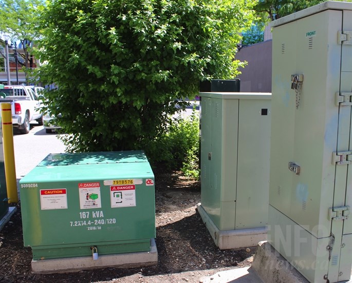 Some of the shrubs around these electrical boxes in a downtown alley were removed in order to discourage camping.