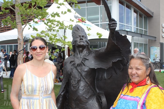 Artist Crystal Przybille and Westbank First Nation Chief Roxanne Lindley are pictured with the statue.