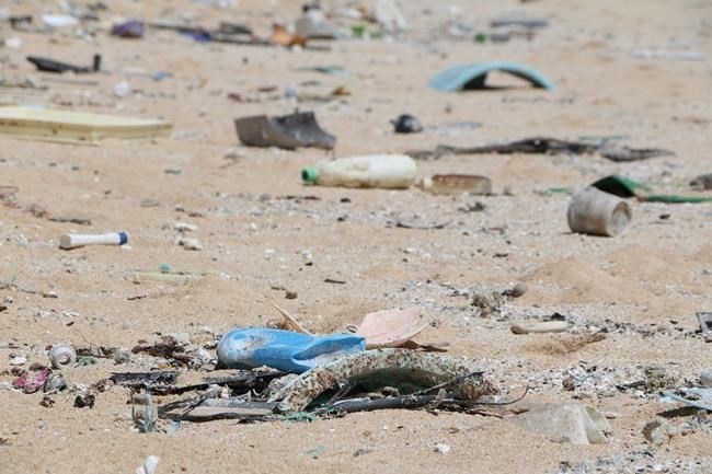In this May 5, 2016 image provided by the state of Hawaii, ocean debris accumulates in Kahuku, Hawaii on the North Shore of Oahu. Beyond simply piling up along the coast, discarded plastics that end up in the ocean could also be a major source of greenhouse gas emissions, according to a study by a Canadian-led team of researchers from the University of Hawaii.
