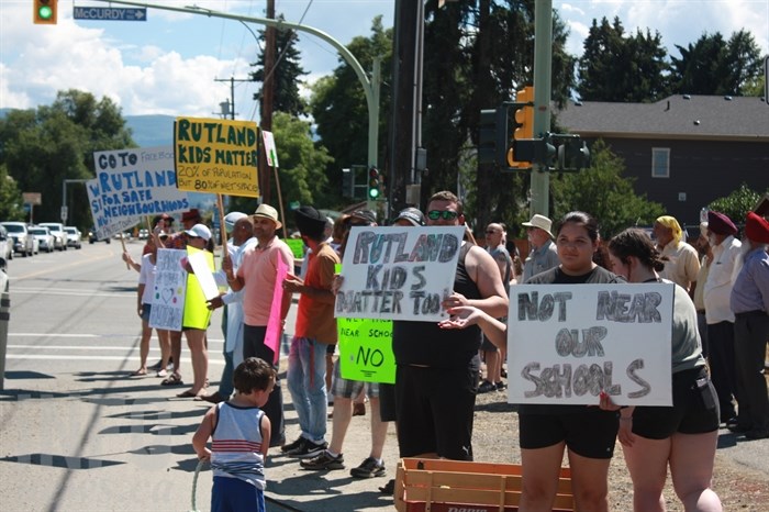 Dozens of protesters gathered on McCurdy Road on June 30, 2019.