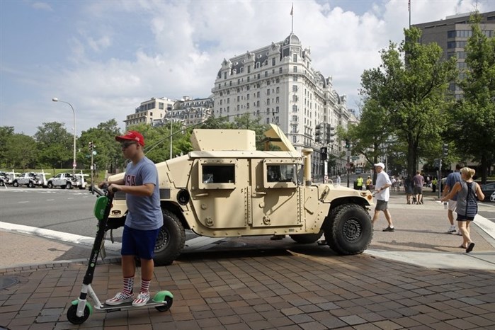 A National Guard vehicle sits parked at a security perimeter near the National Mall in Washington before Independence Day celebrations, Thursday, July 4, 2019. 