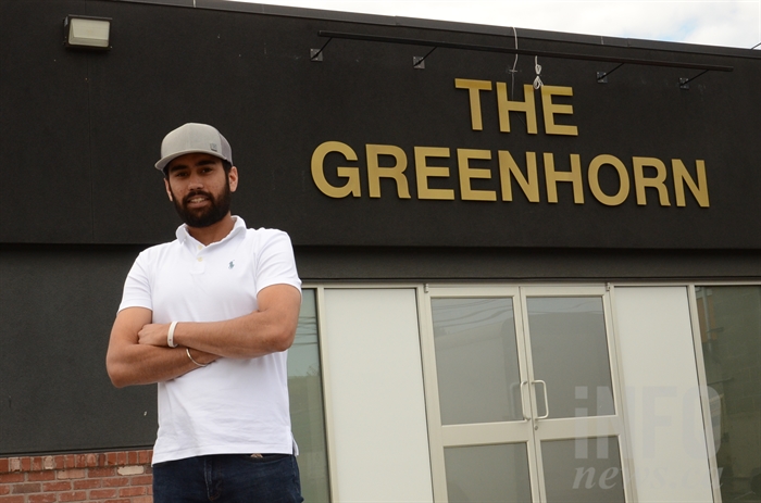 Longhorn Pub owner Aftaab Dhillon stands outside the soon to be open cannabis retail store, The Greenhorn.