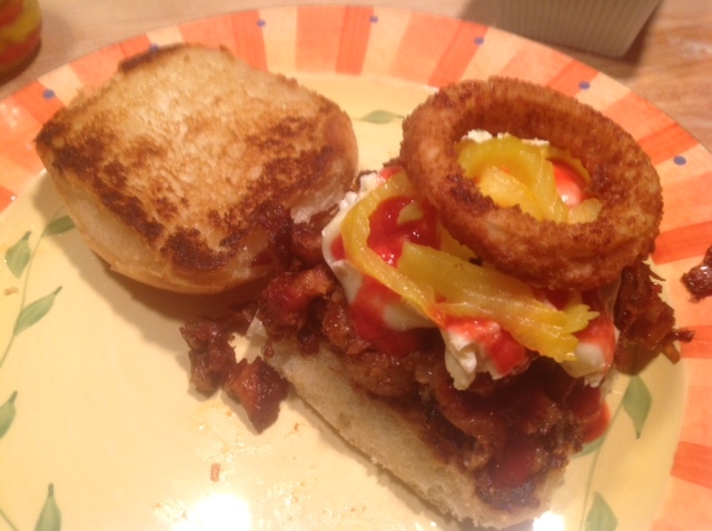 My dark-rum marinaded pulled pork sandwich on a toasted Brioche bun with Brie cheese, raspberry coulis, hot peppers and a homemade french-fried onion ring. Yeah, it’s even better than it looks.