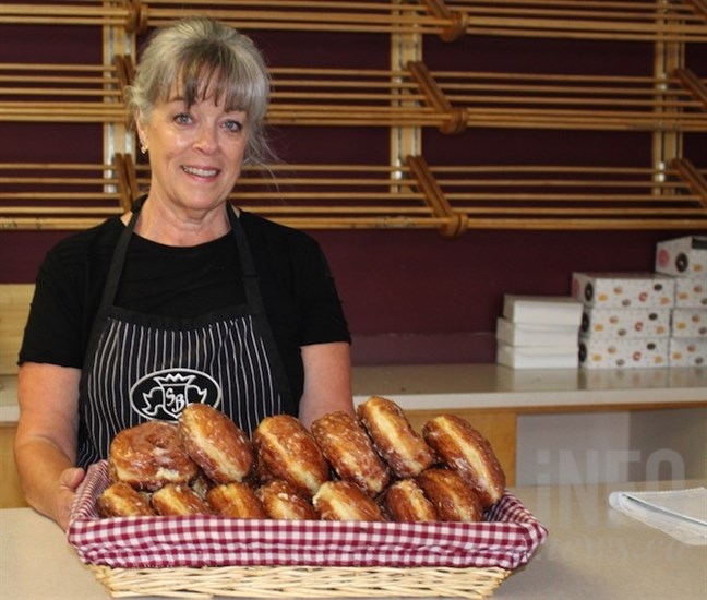 Shelly Burger, a worker at Specialty Bakery in Kelowna, is happy the Kelownut is back.