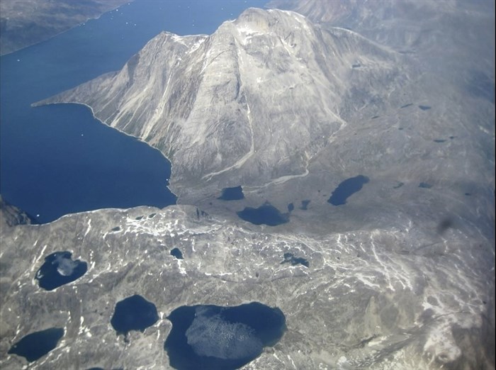 In this image taken on June 22, 2019 an aerial view of melt water lakes on the edge of an ice cap in Nunatarssuk, Greenland.