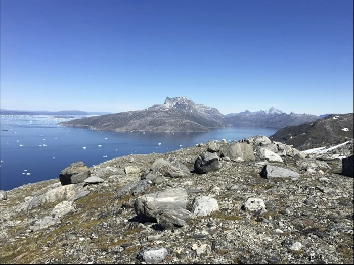 In this image taken on June 15, 2019 small pieces of ice float in the water in Nuuk Fjord, Greenland.