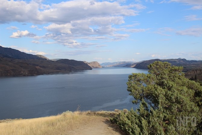 The balancing rock and hoodoos overlook Kamloops Lake.